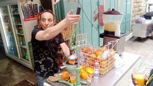 'Interesting juice squeezer outside the Dome of the rock in Jerusalem. Man makes juice in seconds.'