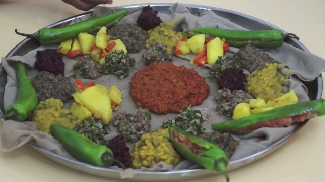 'Ethiopian Food - Beyeyanetu a vegan platter of food on injera - miser - gomen - wot - enjera - sinig'