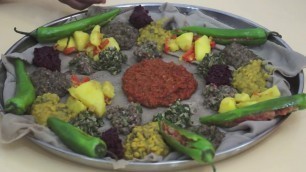 'Ethiopian Food - Beyeyanetu a vegan platter of food on injera - miser - gomen - wot - enjera - sinig'