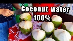 'Young coconut water 100%, Thai street food cart'