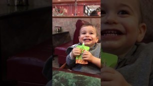 'Baby belly laughs at a Chinese Restaurant on Christmas.'