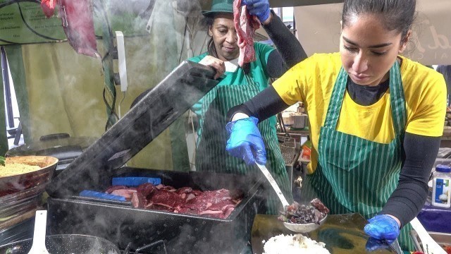 'Food from Brazil, Feijoada, Rice, Farofa, in London. Street food of Shoreditch'