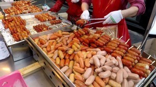 'Best Korea Street Food in Seoul. Sausages, Squids, Lobsters, Scollops and more in Myeongdong'