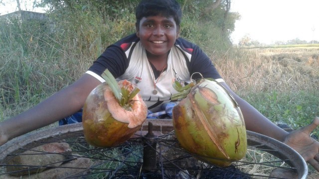 'இளநீர் குள் கோழி பிரியாணி|coconut stuffed chicken briyani cooking|small boy suppu |villagefoodsafari'