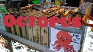 'Taiwan Street food   Dancing Octopus Legs 巨大タコ足の串焼きダンス'