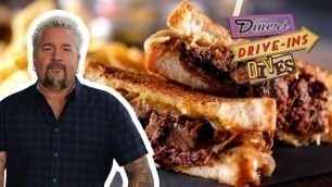 'Guy Fieri Eats a Brisket Melt | Diners, Drive-Ins and Dives | Food Network'